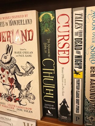 Shelf at waterstones featuring Wonderland and Cursed, edited by Marie O'Regan and Paul Kane