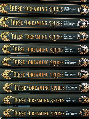 photograph showing a stack of copies of These Dreaming Spires, edited by Marie O'Regan and Paul Kane, showing the books' spines