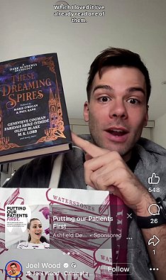 screenshot showing Joel Wood holding up a copy of These Dreaming Spires, edited by Marie O'Regan and Paul Kane