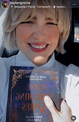 photograph of a smiling Taylor Grothe holding a copy of These Dreaming Spires, edited by Marie O'Regan and Paul Kane