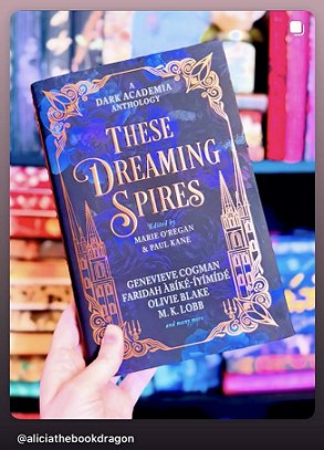 photograph of a woman's hand holding a copy of These Dreaming Spires, edited by Marie O'Regan and Paul Kane, up against a background of full bookshelves