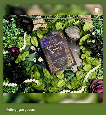 photograph of a copy of These Dreaming Spires, edited by Marie O'Regan and Paul Kane, lying on a bed of leaves