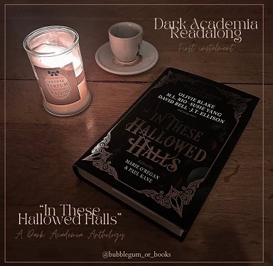 image showing a copy of In These Hallowed Halls, edited by Marie O'Regan and Paul Kane, lying on a wooden surface alongside a coffee cup and saucer and a lit jar candle. Text Reads Dark Academia Readalong, first instalment. In These Hallowed Halls, A Dark Academia Anthology @bubblegum_or_books