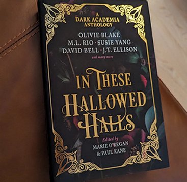 photograph of a copy of In These Hallowed Halls, edited by Marie O'Regan and Paul Kane, lying on a brown leather background