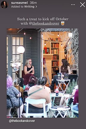 screenshot from @sureasmel. Image shows M L Rio and a woman with a microphone on a stage at a bookstore event. Text reads Such a treat to kick off October with @thebookandcover