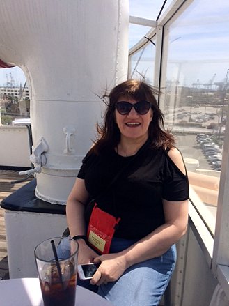 Marie O'Regan relaxing outside on the observation deck of The Queen Mary at StokerCon 2017