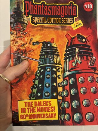 photograph of a man's hand holding up a copy of the Phantasmagoria Daleks Special. Text of subtitle reads: THE DALEKS IN THE MOVIES! 60th ANNIVERSARY